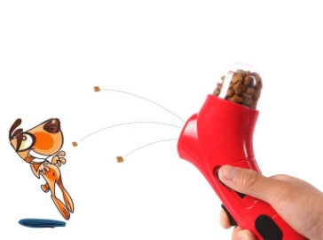 Red pet treat launcher dispensing kibble treats for interactive cat and dog play