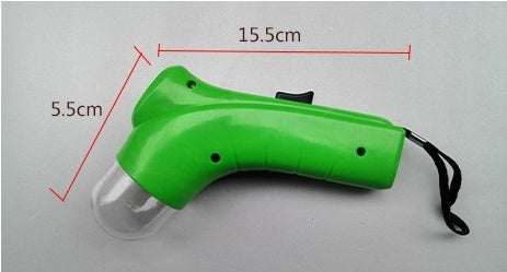 Green pet treat launcher with ergonomic handle and wrist strap, measuring 15.5cm by 5.5cm, designed for easy and fun treat dispensing for dogs and cats.
