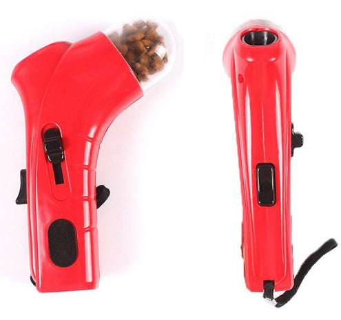 Red pet treat launcher for dogs and cats with ergonomic grip and wrist strap, made of durable ABS plastic.