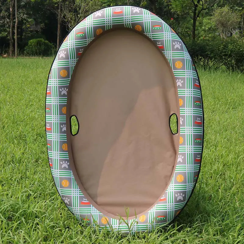 Inflatable dog swimming pool hammock for pets with brown plaid design on a grassy field.