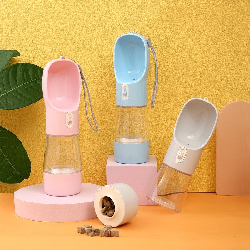 Portable pet dog water bottle with built-in drinking bowl in pink, blue, and grey colors for outdoor travel.
