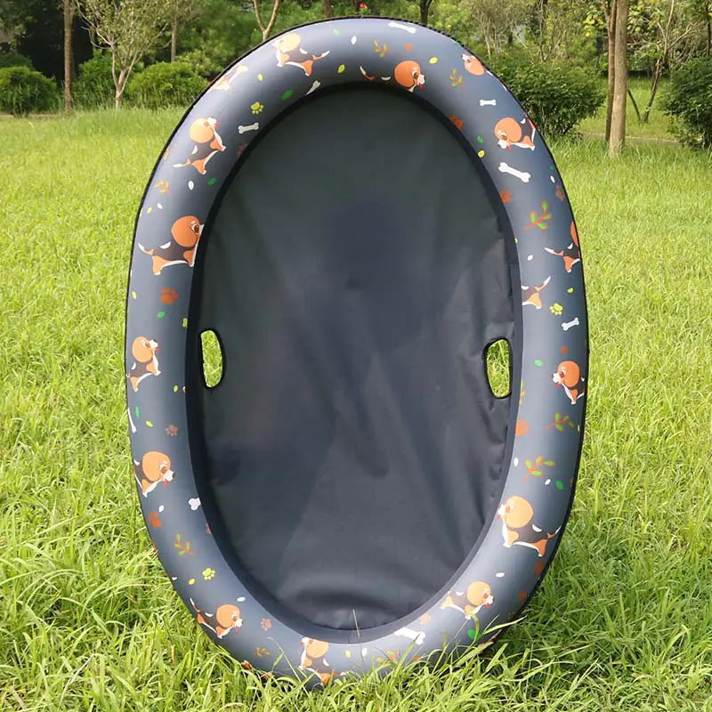 Inflatable dog swimming pool hammock for pets on grass background.
