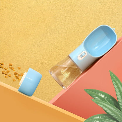 Portable blue pet dog water bottle with built-in drinking bowl and food container for outdoor travel