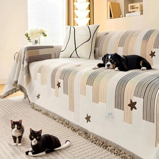 Anti-scratch sofa cover protecting couch from pet scratches with dog and cats present.